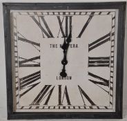 A large metal framed station clock of square form with roman numerals having battery movement and