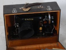 A vintage faux crocodile skin cased singer sewing machine
