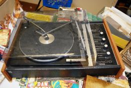 A retro Richmond turntable having teak effect case with smoked plastic cover