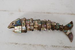 Early 20th century articulated abalone fish bottle opener 21cms long