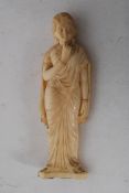 An early 20th century carved ivory figure of an indian woman approx 12cm high
