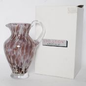 A Waterford crystal jug / vase in the ` Urban Safari ` pattern, 25.5cm tall