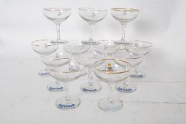 Breweriana: A collection of 12 vintage Babycham glasses circa 1960`s, each with a white fawn, and