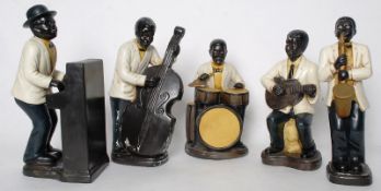 A vintage bisque composition set of `Negro Jazz Bandsmen` - figurines of musicians, including