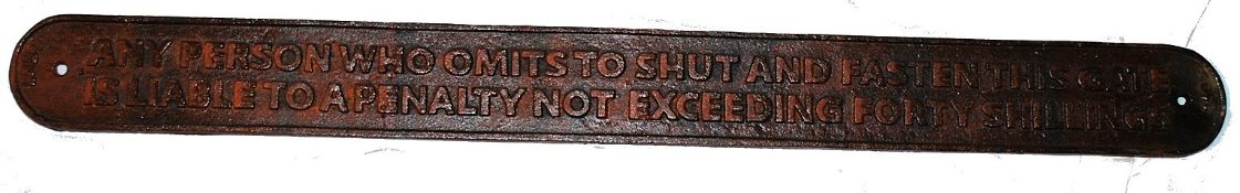 A vintage style railway sidings sign `Liable to a penalty of forty shillings` sign. With rust