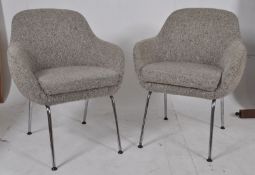 A pair of 1970`s retro tub armchairs upholstered in a chequered wool fabric stood on tubular chrome