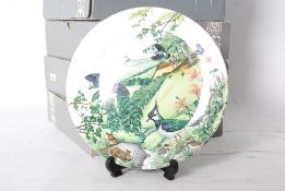 A collection of Wedgwood cabinet collectors plates complete in boxes with certificates. Colin
