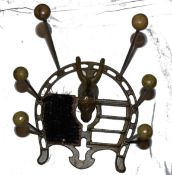 A vintage metal horse themed boot scraper, with shoe holder balls to top on long metal poles and