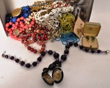 A box of costume jewellery to include a Victorian vulcanite locket together with assorted 1960`s