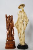 A Chinese composite figure along with a wooden carved indian statue