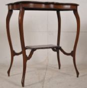 Edwardian solid mahogany occasional table. Raised on shaped supports with twin tiers, the lower