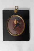 A 19th century antique miniature oil painting of a gent, being on ivory in original oval ebonised