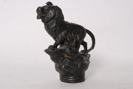 Traction engine mascot in the form of a lion on a rock, impressed ` made in england `