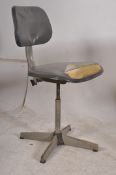 An 1950#s original industrial metal swivel office chair. The tubular metal frame having adjustable