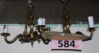 A pair of guilded metal triple light wall sconces with lustres.