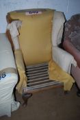 A vintage Parker Knoll wingback armchair