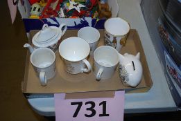 A collection of commemorative china to include cups, vase and other items.