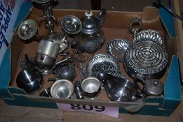 A box of silver plate items to include a teapot, jugs, rose bowl and other items.