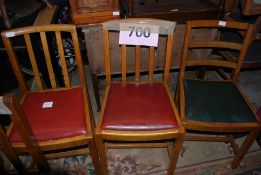 Three  1950's oak drop in seat dining chairs.