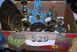 A box of brass trays, candle stick, ash tray, bells etc.