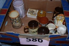 A collection of assorted items to include a Sandland musical tankard, Cocnag Martell toby jug,
