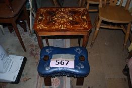 An inlaid musical occassional table along with a blue leather camel stool