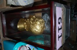 A cased plaster bust of a child mounted within a good glass display case. 50cm tall.