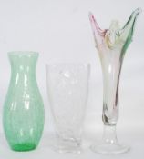 Three vases, one studio glass, one art nouveau style and the other with a crackle effect.