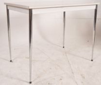 A 1970`s retro formica and chrome kitchen dining table. Raised on turned and tapering chrome legs