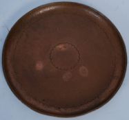 A Newlyn of Cornwall copper charger tray. Circular form having scalloped decoration, stamped Newlyn