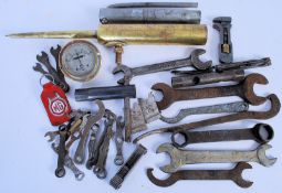A collection of vintage motorcycle tools to include Triumph spanners, tyre levers, oil pump and