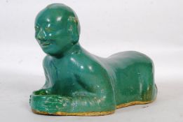 A late 18th / early 19th century Chinese oriental celadon green head rest / pillow depicting a
