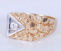 An 18ct gold gentlemans signet ring having inset diamond to off-centre set within a triangle with
