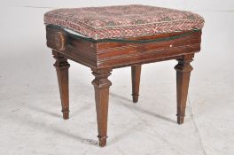 An Edwardian Brooks metamorphic piano stool, the adjustable upholstered seat having turned handles