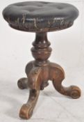 A Victorian mahogany revolving piano stool with tripod base turned column, leather swivel seat.  H