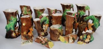 A collection of Sylvac vases, logs, baskets etc to include pattern numbers 1510 (twice), 353,