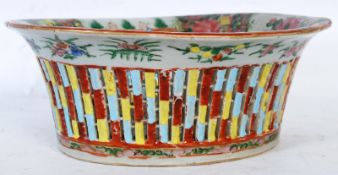 A Chinese Canton oriental lattice work bowl, with hand painted decoration in the form of flowers