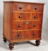 A Georgian mahogany commode chest of drawers. The turned legs supporting a faux drawer front having