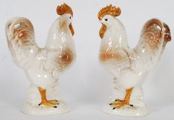 Two Staffordshire cockerels, circa early 20th century raised on plinth bases. marked to base.AR112
