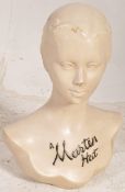 A 1940`s advertising hat shop display stand for ` A Marsten Hat ` in the form a young lady with