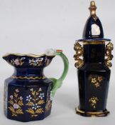 A Masons cobalt and gilt ironstone jug of octagonal form with green hydra handle. Measures 18cms