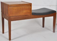 A retro 1970`s Mr Chippy teak wood telephone / hall table. Raised on square tapered legs with black