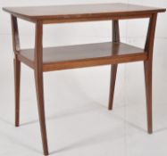 A 1970`s Danish teak wood two tier occasional / lamp table in lozenge form. The rectangular top