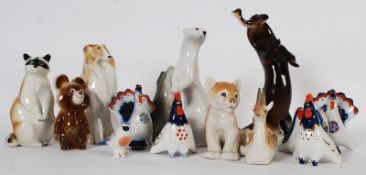 A good collection of USSR figurines to include otter, bear, dog, peacock group, mink, deer, seal