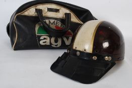 A vintage 1950`s motor racing helmet by Slazenger being lined to the interior with central white