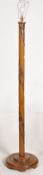 A 1950`s Chinese carved hardwood standard lamp raised on turned base with thick column and light