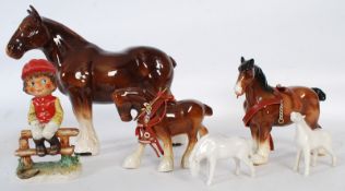 Gobel figure of a boy jockey Michel T. and five models of horses.