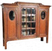 A good 1920`s Art Nouveau french oak bookase display cabinet of large proportions. Raised on square