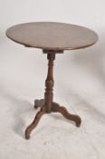 A good 18th century George III country oak bird cage occasional tripod table. Having 3 splayed legs