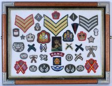 A collection of vintage military army uniform patches and badges to include RAMC, Sergreant stripes